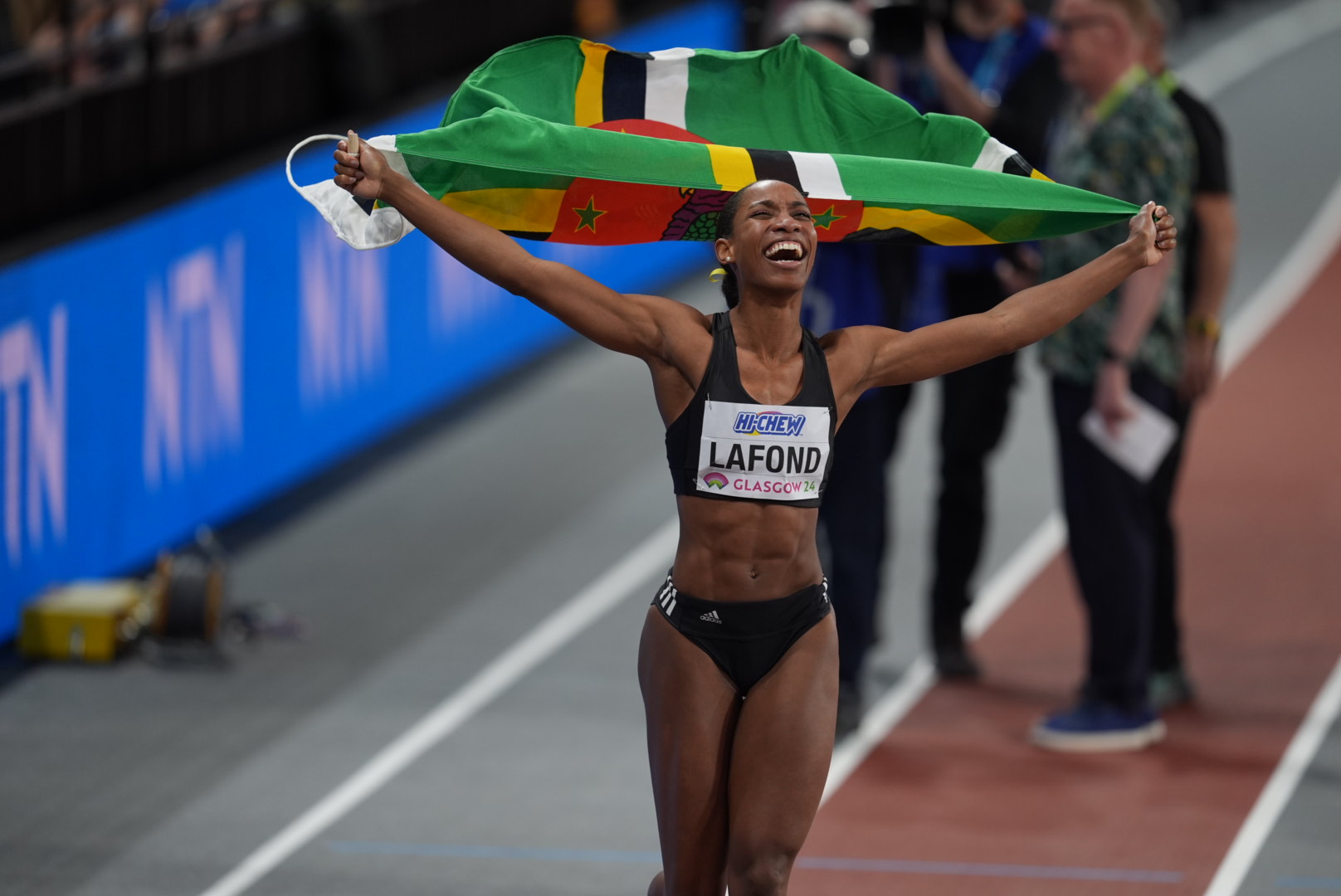 Athlete celebrating under stadium lights