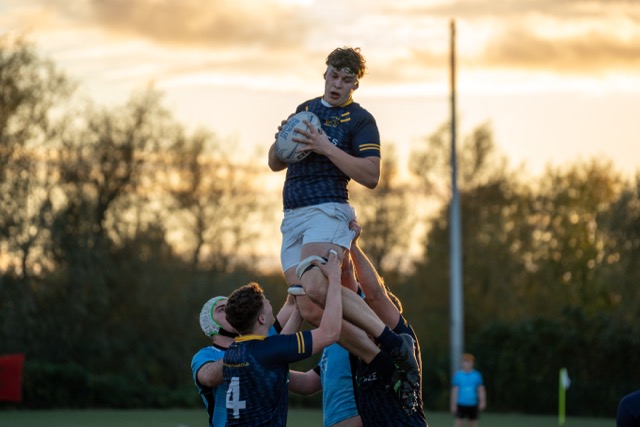 Rugby players celebrating with medals